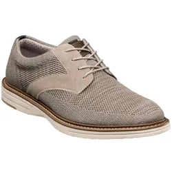 A beige men's dress shoe with a knitted mesh and suede design, featuring a lace-up closure and a white cushioned sole for a casual yet formal look.