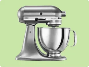 A silver stand mixer with a mixing bowl, featuring multiple speed settings, typically used for baking and cooking tasks.