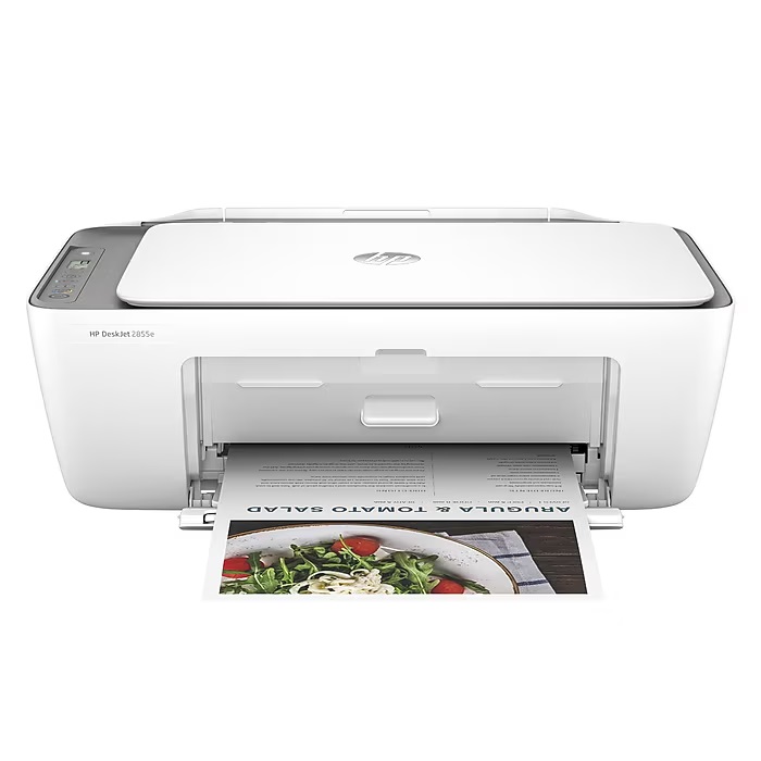 White HP DeskJet 2655 all-in-one printer with an open paper tray, printing a colorful document.