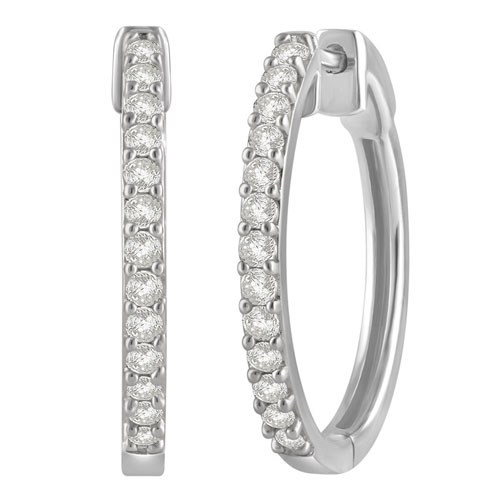 Silver hoop earrings encrusted with small round diamonds in a pave setting, adding elegance and sparkle.