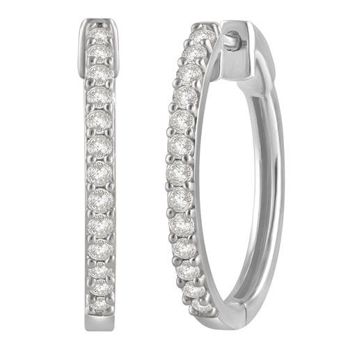 Silver hoop earrings encrusted with small round diamonds in a pave setting, adding elegance and sparkle.