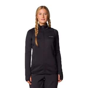A woman wearing a black Columbia Omni-Heat full-zip jacket with zip closure and fitted design, featuring thumbholes and Columbia logo on the chest.