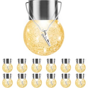 12-pack of hanging solar-powered LED crackle glass globe lights with metal tops, emitting a warm white glow. Includes clips for easy attachment. Suitable for outdoor use.