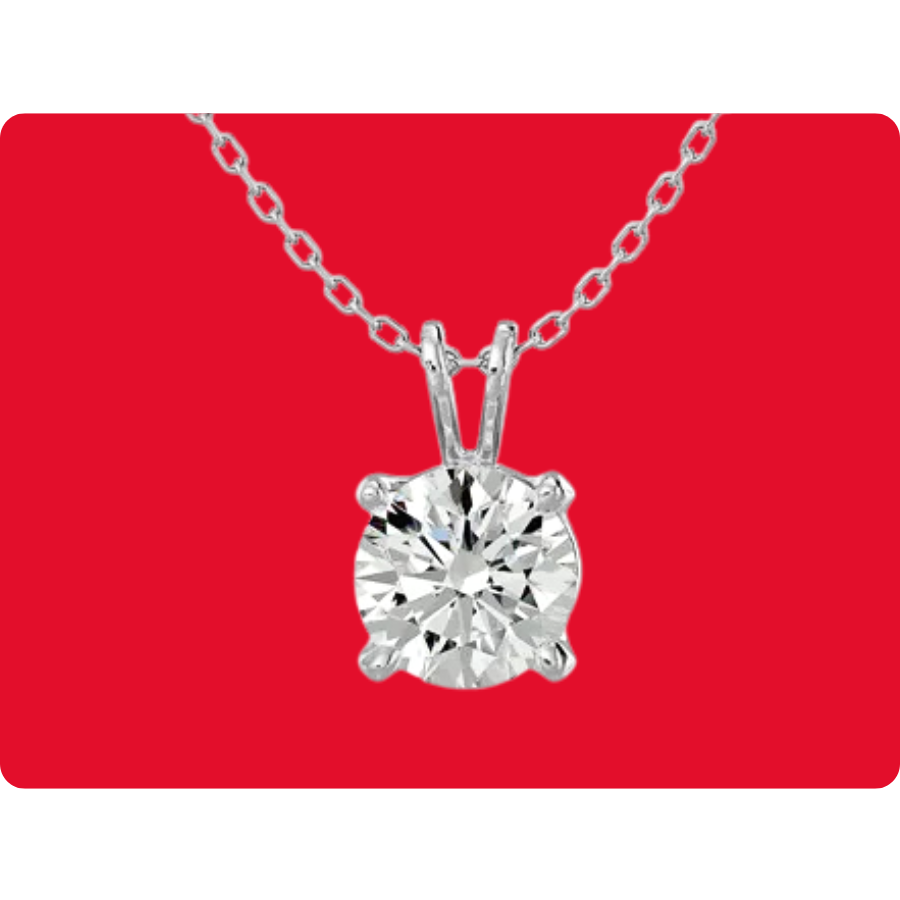 A necklace with a round-cut diamond pendant set in a four-prong setting on a delicate chain, displayed against a red background.