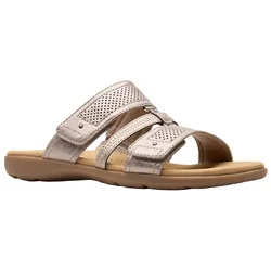 A beige slip-on sandal featuring two adjustable straps with perforated details and a cushioned sole for comfort.