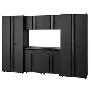 A modular black storage cabinet system with multiple compartments, ideal for garages or workshops. It features tall side cabinets, a central counter space, and wall-mounted cupboards for organized storage.