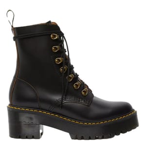 Dr. Martens Leona Boots are black leather lace-up boots featuring a chunky platform heel, grooved edges, and signature yellow stitching.