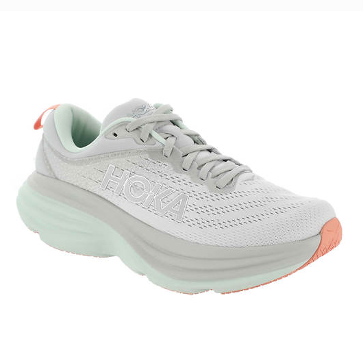 Hoka running shoe with a light-colored mesh upper, mint green cushioned sole, and coral accents.