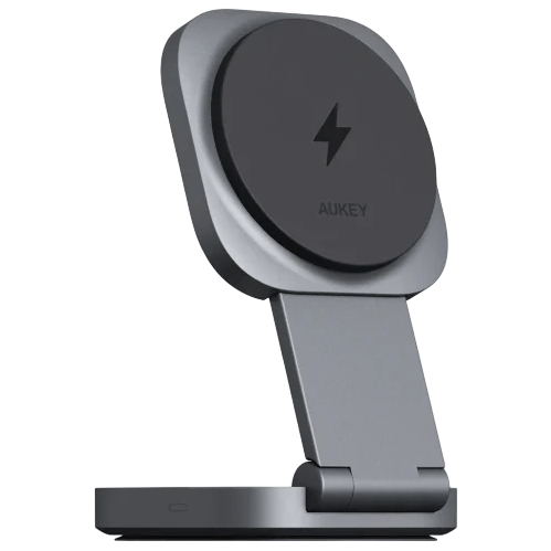 A foldable wireless charging stand featuring a circular charging pad with a lightning bolt symbol, branded with \“AUKEY\“, supported by a hinged arm on a rectangular base.