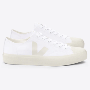 White low-top sneakers with a minimalist design, featuring a subtle logo on the side and cream-colored soles.