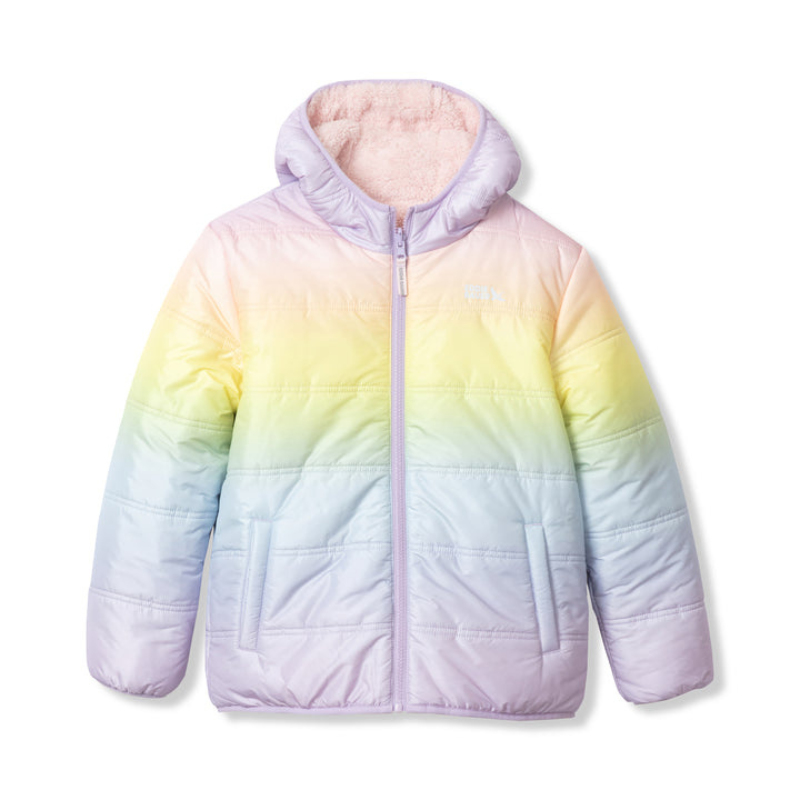 A girls' reversible hooded jacket featuring a pastel ombre pattern with shades of purple, pink, yellow, and blue. It has a front zipper and two side pockets, offering warmth and style with a soft, plush lining.