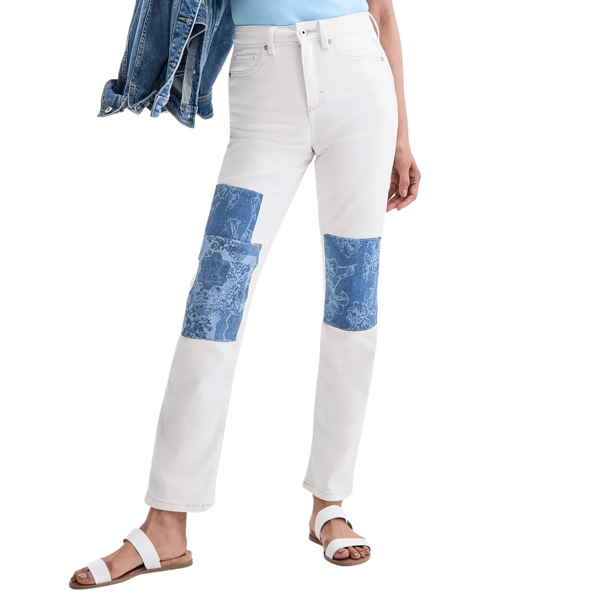 White jeans with blue patterned patches on the knees, paired with a blue top, denim jacket, and white sandals.