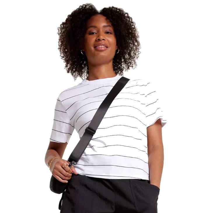 White short-sleeve T-shirt with thin black horizontal stripes, paired with a black crossbody strap.
