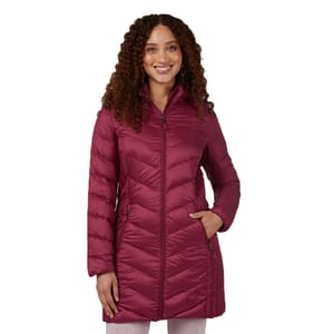 A woman wearing a burgundy quilted coat with a zippered front and side pockets.