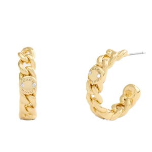 A pair of gold-tone chain-link hoop earrings featuring the brand name \“Coach\“ on small circular accents.