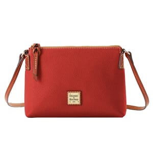 Red Dooney & Bourke crossbody bag with a pebbled leather texture, featuring a zipper closure, adjustable strap, and a square brand logo on the front.