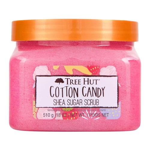 A pink jar of cotton candy scented sugar scrub with an orange lid.