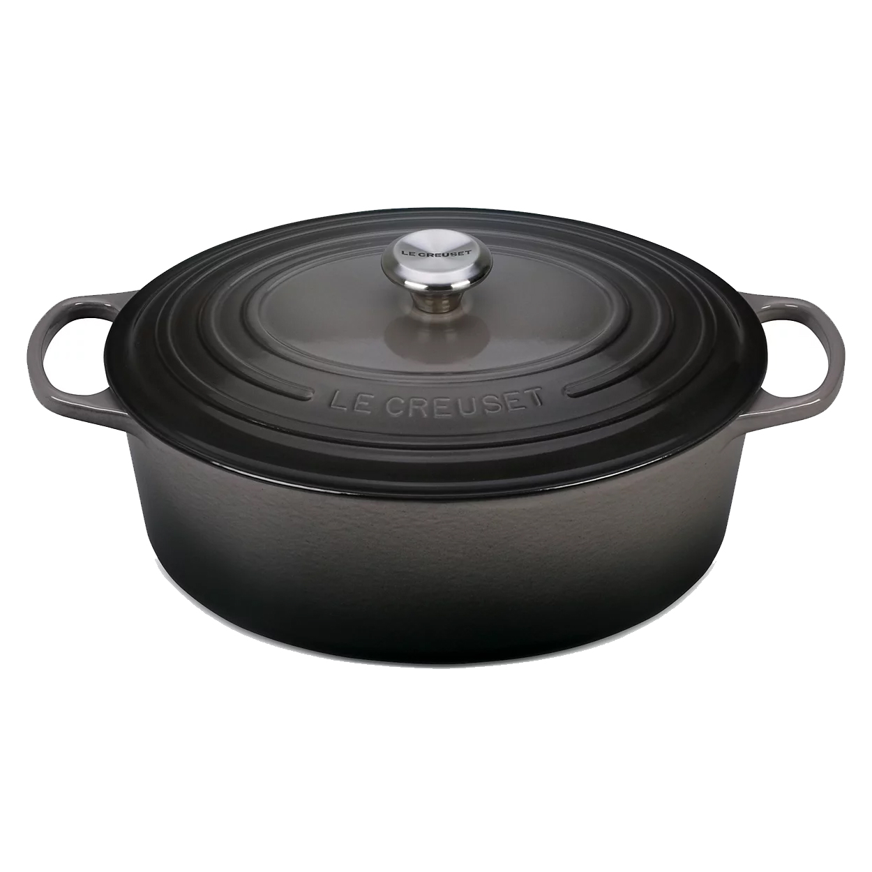 Le Creuset oval cast iron Dutch oven with a dark finish and metallic knob. Features side handles and the Le Creuset branding on the lid.