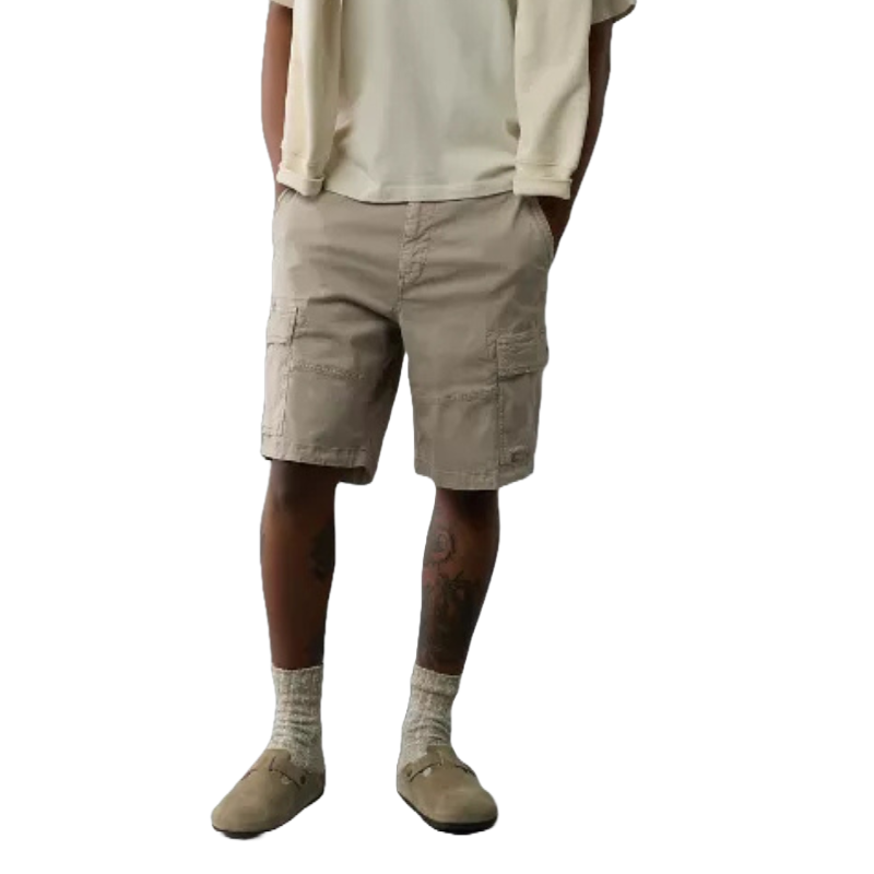 AE 10\“ Flex Lived-In Cargo Short features a relaxed fit with multiple pockets, made from flexible, durable material for comfort and practicality. It's styled with a casual tee, a sweater draped over the shoulders, socks, and loafers.