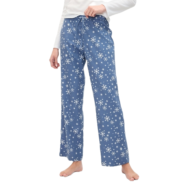 Blue flannel pajama pants with an all-over white snowflake pattern. They feature an adjustable drawstring waist and a relaxed, straight-leg fit, offering comfort and a festive design.