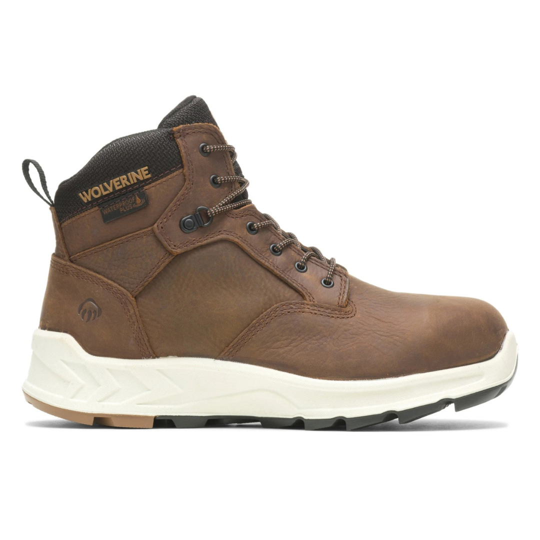 Brown leather work boot with a white sole, featuring \“Wolverine\“ branding, waterproof technology, and metal eyelets.