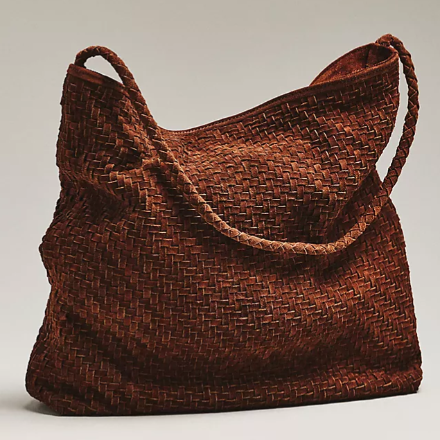 A brown woven shoulder bag with a textured pattern and a single braided strap.