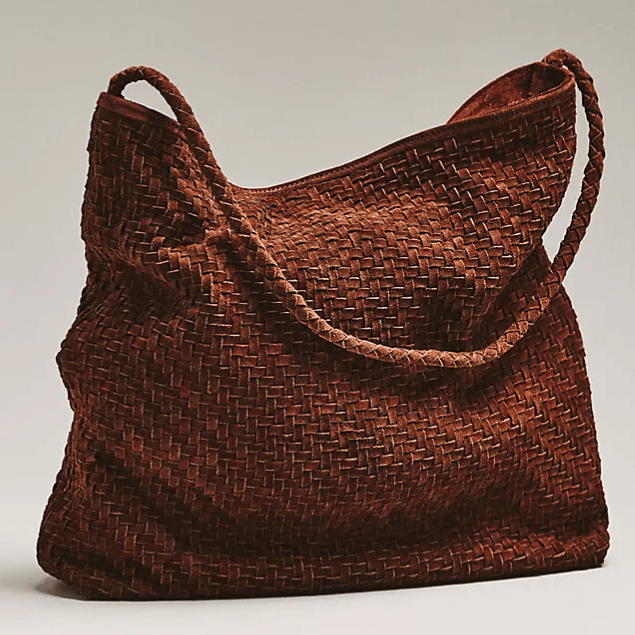 A brown woven shoulder bag with a textured pattern and a single braided strap.