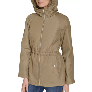 Beige hooded jacket with a front zipper, drawstring waist, and two front pockets, worn over blue jeans.