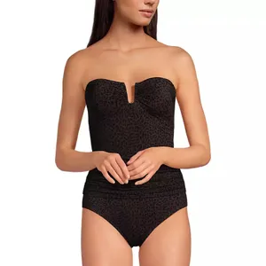 A strapless, textured black bodysuit with a subtle leopard print pattern. It features a unique notched neckline and ruched detailing at the waist.