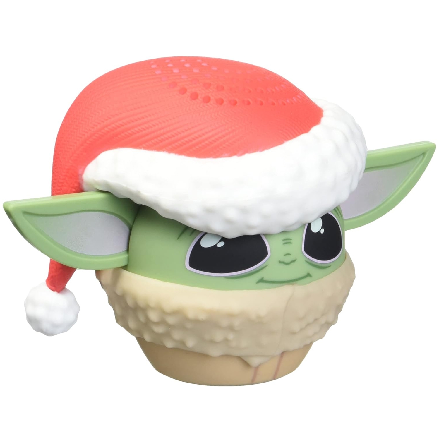 A small, green character speaker resembling Grogu from the Star Wars series, wearing a red and white Santa hat, designed as a portable audio device with speaker holes on top.