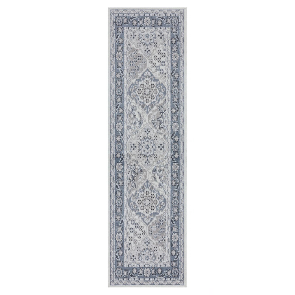 A narrow, rectangular runner rug with a detailed floral and geometric pattern in shades of gray and blue, featuring a decorative border.
