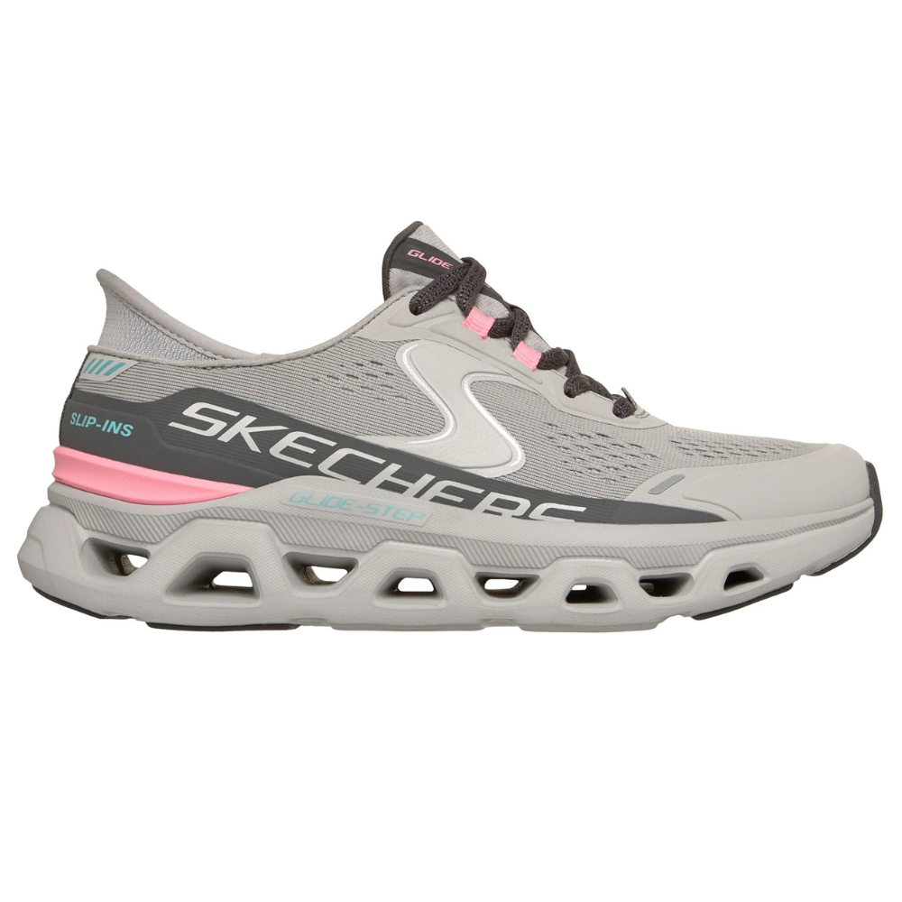 A gray Skechers Slip-Ins Glide-Step shoe with a breathable mesh upper, featuring pink and teal accents. The shoe has a distinctive open cellular outsole design.