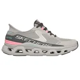 A gray Skechers Slip-Ins Glide-Step shoe with a breathable mesh upper, featuring pink and teal accents. The shoe has a distinctive open cellular outsole design.