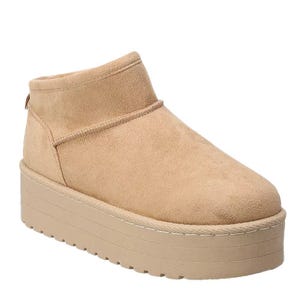 A beige suede boot with a thick platform sole, designed for a slip-on style.