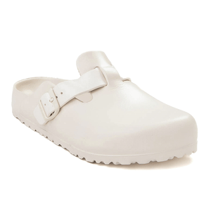 Birkenstock Men's Boston Clogs feature a slip-on design with an adjustable buckle strap, smooth upper, and contoured footbed for comfort. They have a solid white color with a textured sole for grip.