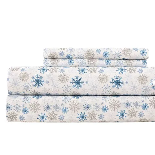 Set of bed sheets with a snowflake pattern in blue and gray on a white background.