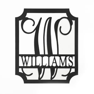 A black 12\“ monogram wall sign featuring the letter \“W\“ in an elegant, stylized design, with the name \“Williams\“ in bold letters below.