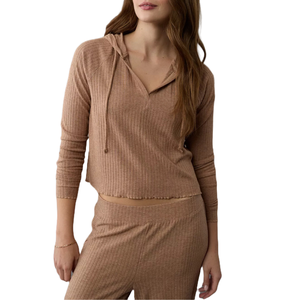 A ribbed, brown, long-sleeve cropped hoodie made of soft fabric, paired with matching lounge pants.