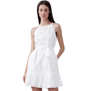 White sleeveless mini dress with a halter neckline, cinched waist with a bow tie, and a tiered ruffle hem, crafted from poplin fabric.