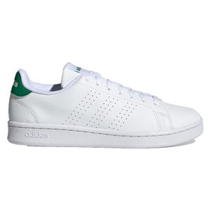 White sneaker with green detailing on the heel and perforations on the side.