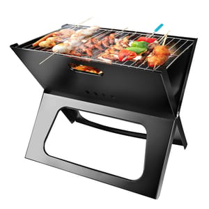 Portable charcoal grill with various skewered meats and vegetables cooking on the grate.