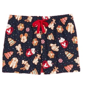 Black shorts with a festive holiday pattern featuring cartoon characters, gingerbread cookies, Christmas trees, and peppermint candies, and a red drawstring.