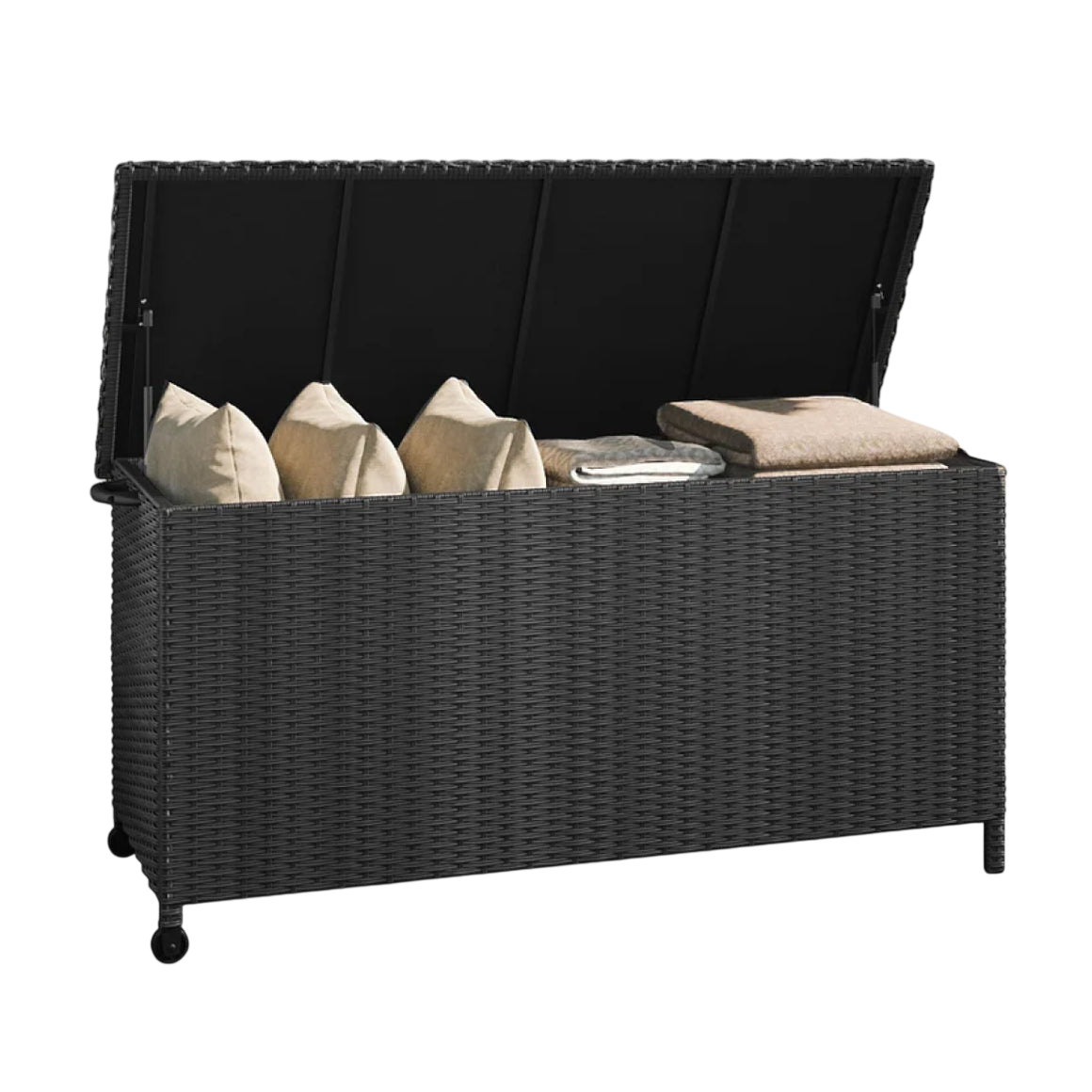 A black rattan outdoor storage box with a hinged lid, containing beige cushions and folded blankets.