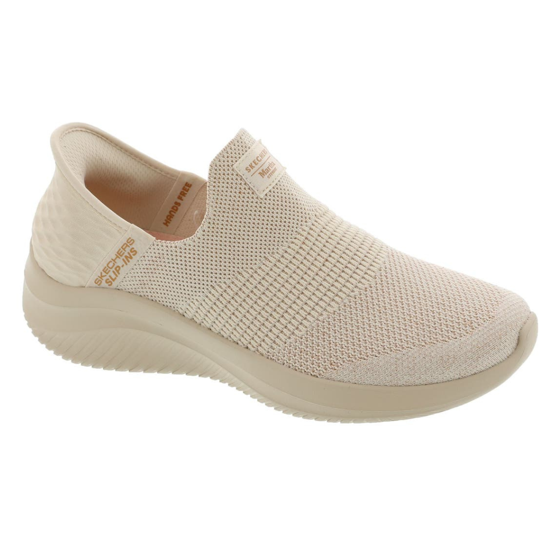 Beige slip-on sneaker with a knitted upper and cushioned sole, labeled \“Skechers Slip-ins.\“