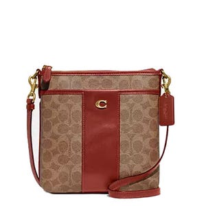 Brown and red crossbody bag with monogram pattern and gold hardware, featuring a central leather panel and a \“C\“ emblem.