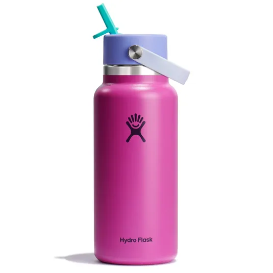 A pink Hydro Flask water bottle with a purple straw lid and a turquoise straw, featuring the brand's logo.
