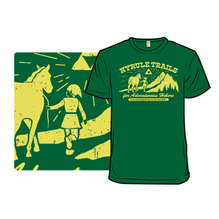 A green t-shirt featuring a design inspired by \“Hyrule Trails\“ with a whimsical depiction of a person and a horse, mountains in the background, and the text \“for Adventurous Hikers\“ and \“It's dangerous to go alone.\“