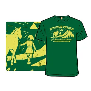 A green t-shirt featuring a design inspired by \“Hyrule Trails\“ with a whimsical depiction of a person and a horse, mountains in the background, and the text \“for Adventurous Hikers\“ and \“It's dangerous to go alone.\“