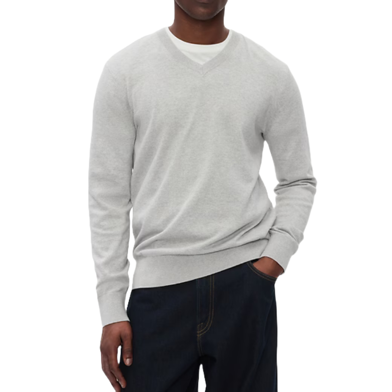 Gray cotton V-neck sweater with long sleeves and ribbed cuffs and hem, worn over a white T-shirt.