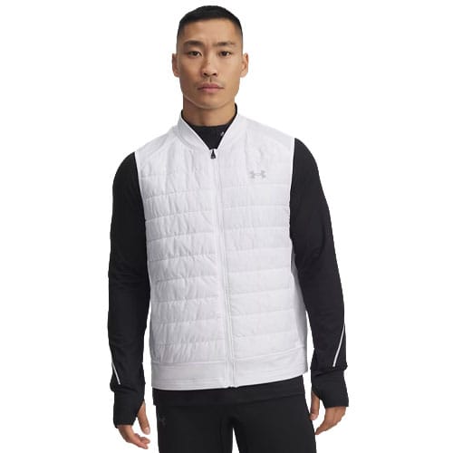 A man wears a white, quilted zip-up vest with an Under Armour logo over a black long-sleeve shirt.